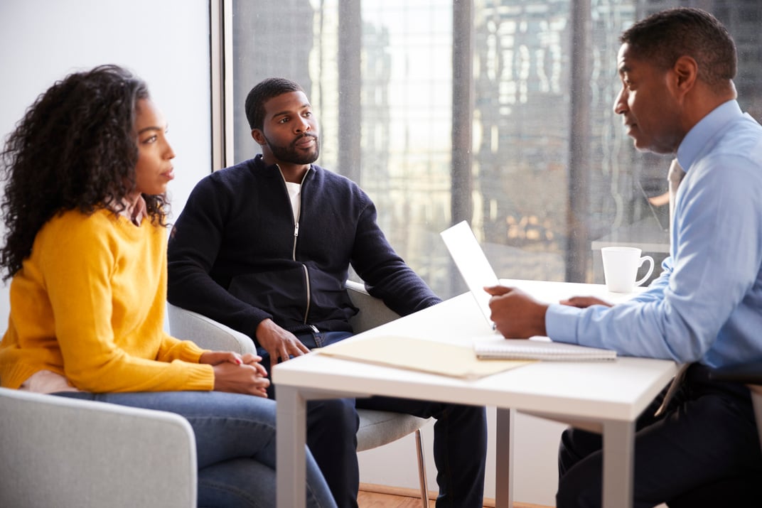 Couple Meeting with Male Financial Advisor